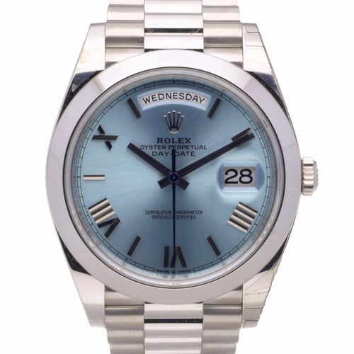 Lionel Messi wearing a platinum Rolex Day-Date 40 watch
